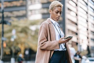 Businesswoman looking at her phone